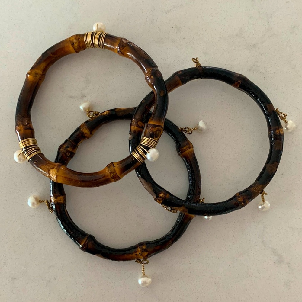 Bamboo and pearl drop bangle bracelets.